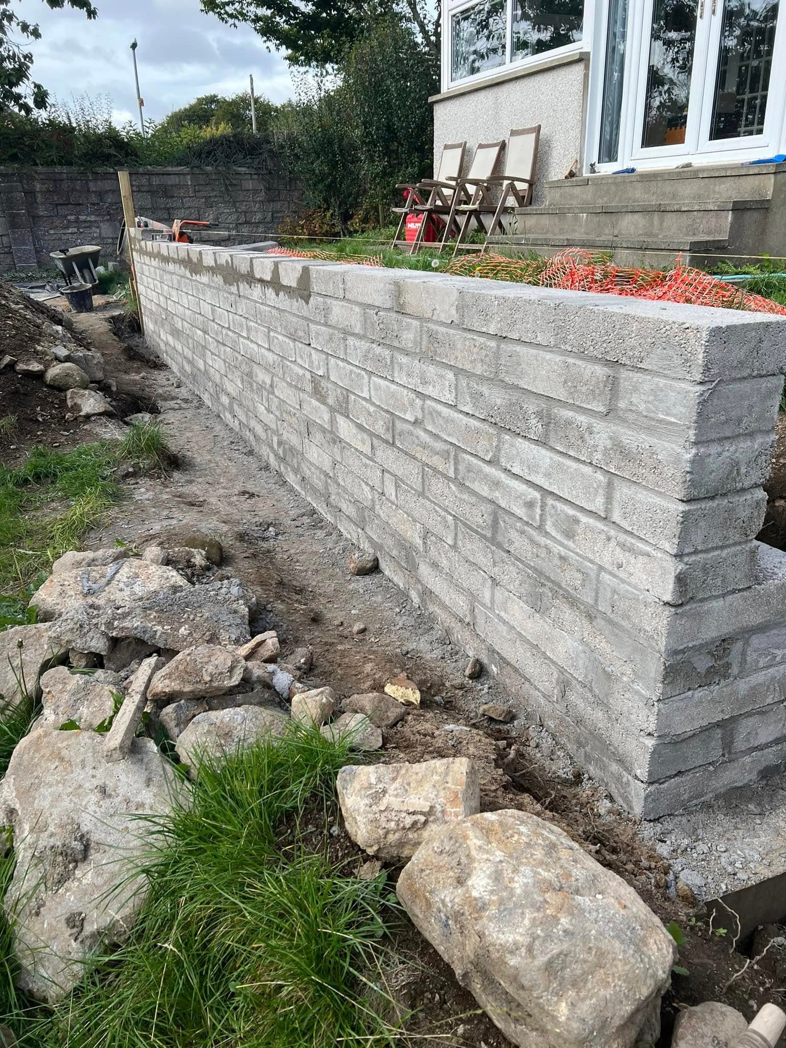 Brick retaining wall construction by Greenwell