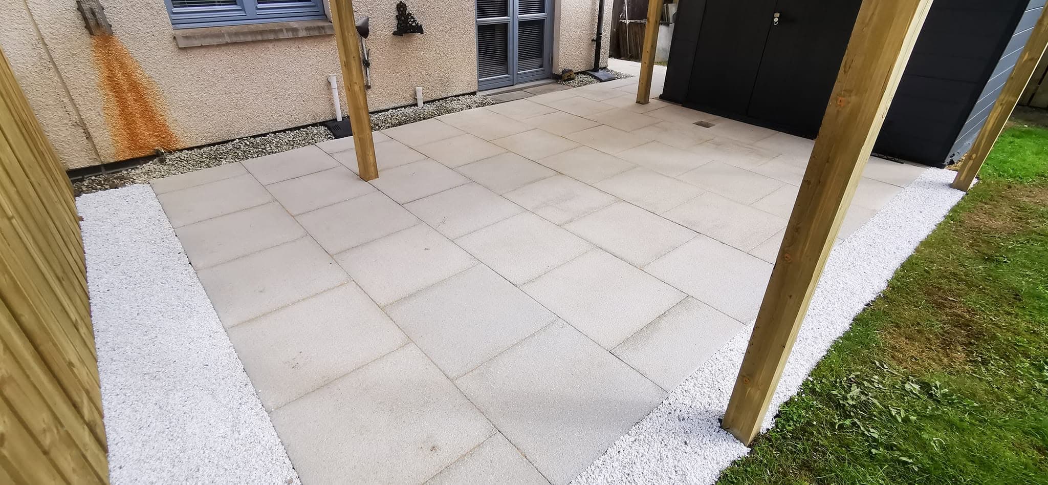 Completed garden landscaping with paving and planting borders
